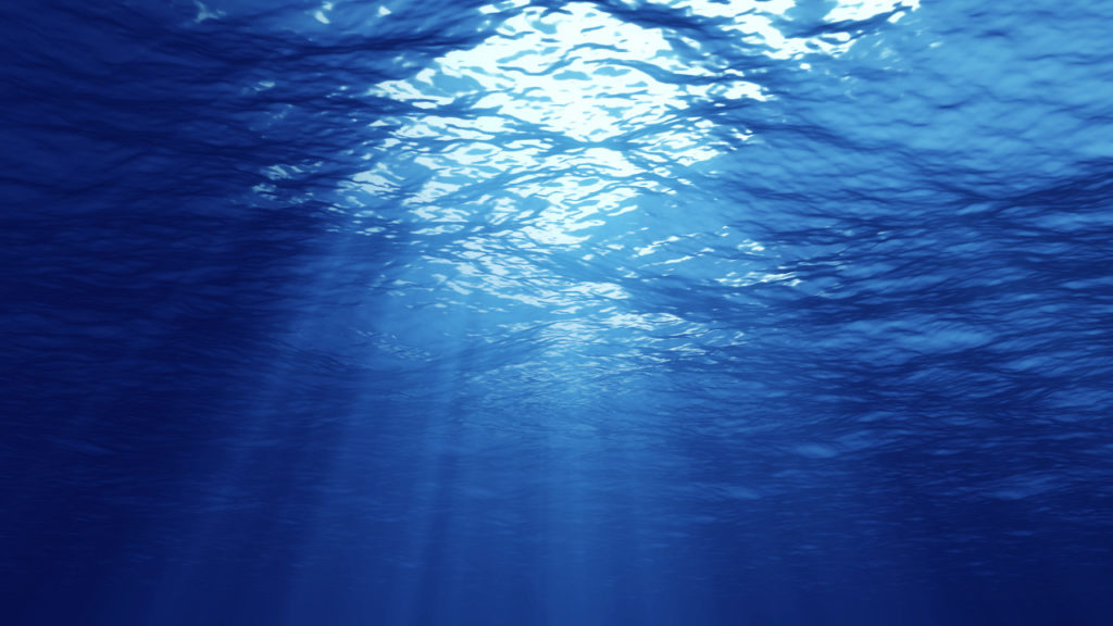 3D rendering of rays of sunlight shining from above, penetrating deep clear blue water, resulting in a beautiful water curtain reflecting light